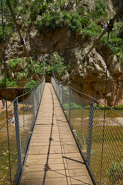 istock Footbridge, rope suspension bridge over the river Turia 2222306119