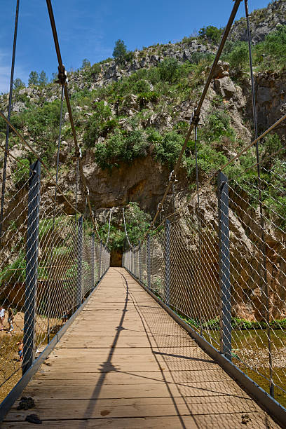 istock Footbridge, rope suspension bridge over the river Turia 2222306334