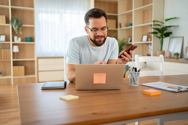 istock Freelancer working from home using laptop and smartphone 2222307102
