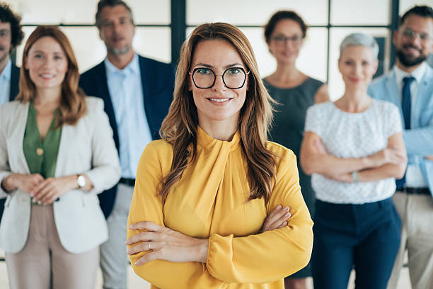 istock Confident business woman and her team 2222307205