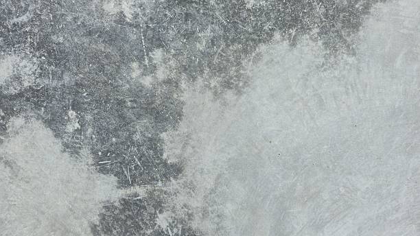 istock Gray concrete sidewalk with stains and uneven color. 2222310849