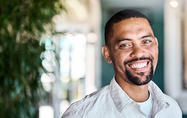 istock Smiling handsome mature male looking at camera indoors 2222313669
