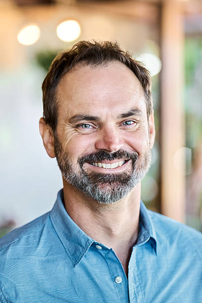 istock Portrait of happy mature man smiling confidently 2222313708
