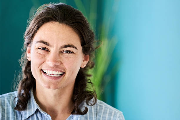 istock Cheerful young woman smiling radiantly 2222313752