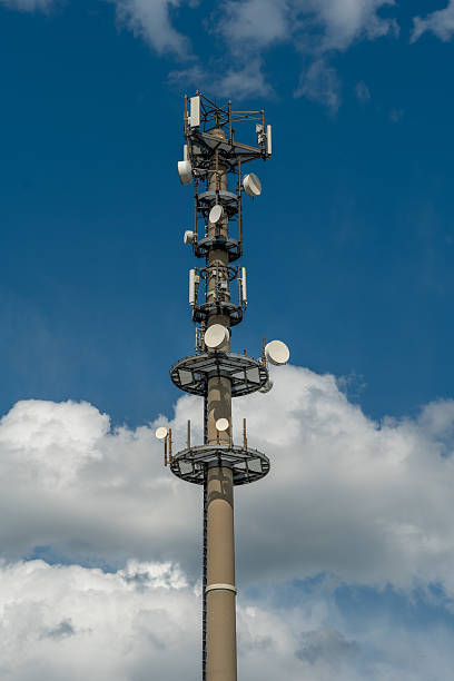 istock Communications tower reaches for the sky amidst fluffy clouds on a bright sunny day 2222314365