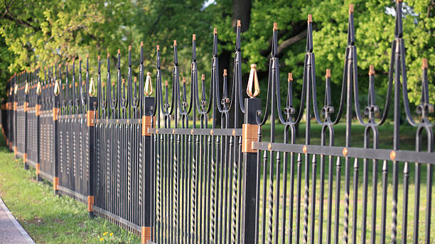 istock fence with gold decoration 2222315187