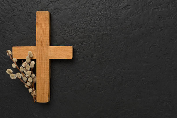 istock Cross with willow branches on concrete background, top, view. Palm Sunday concept 2222317149