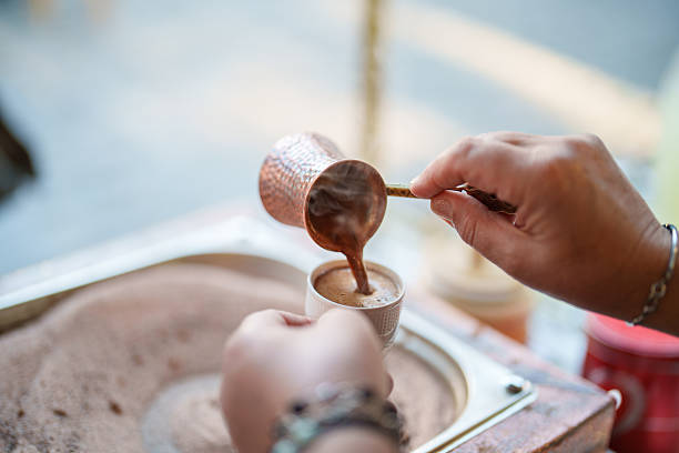 istock Pouring Turkish Coffee from Cezve Roasted in Hot Sand 2222323394