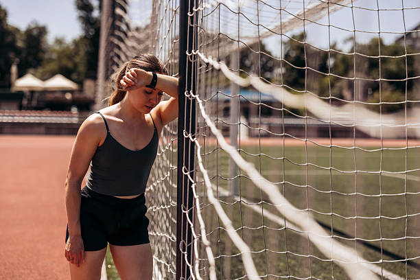 Tired Athlete woman runner on athletics track