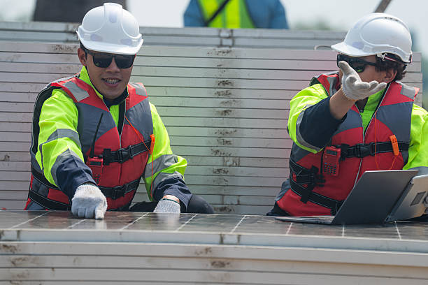 Workers Technicians are working to construct solar panels system on construction site. engineers are checking before Instal solar photovoltaic panel system. Renewable clean energy technology concept.