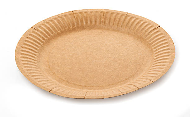 istock Empty round brown disposable paper plate on white background 2222343550