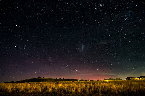 The Southern Lights - Aurora Australis and the night sky filled with stars in Blayney, Central West, NSW, Australia.