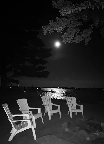 istock Full Moon over the family lake chairs 2222347984