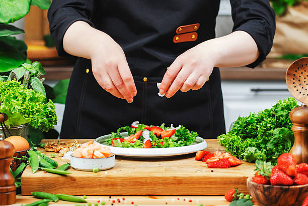 istock Creating a colorful shrimp salad with fresh vegetables in a cozy kitchen setting 2222349391