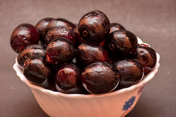 istock Fresh Organic Black Currants in a Small Bowl on White Background 2222352603