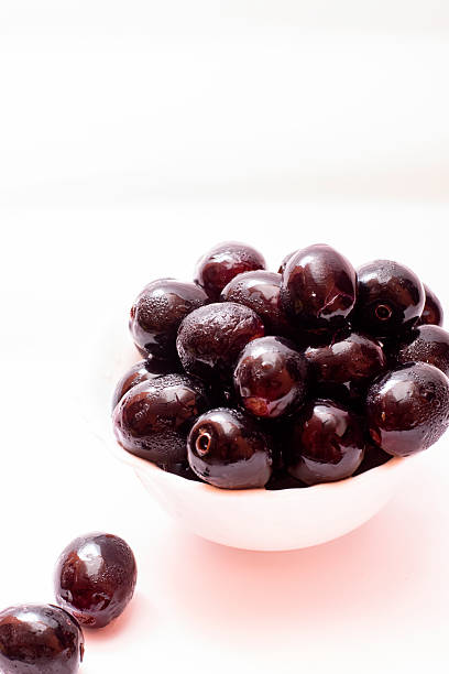 istock Fresh Organic Black Currants in a Small Bowl on White Background 2222352639