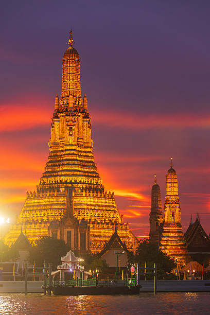 Twilight view of Wat Arun Ratchawararam Ratchawaramahawihan at sunset in bangkok Thailand. Landmark of Along the Chao Phraya River Thailand