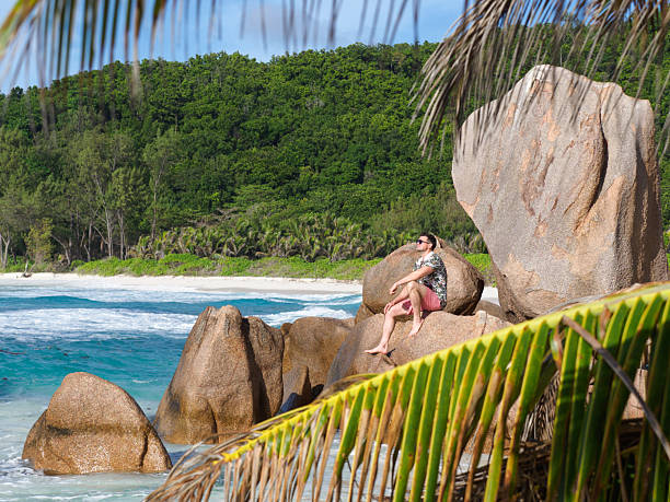 istock Handsome man and stunning white sand beach 2222360243