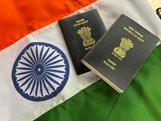 istock indian passport with Indian flag 2222360516