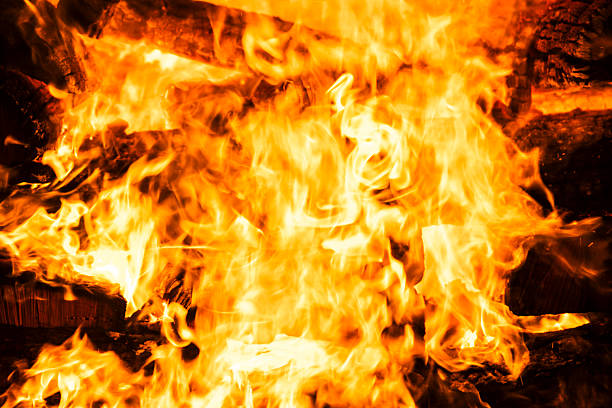 istock Narrow focus of a crackling bonfire at night 2222367329