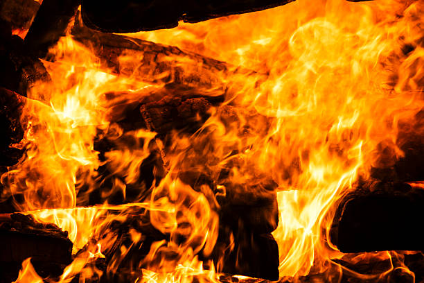 istock Narrow focus of a crackling bonfire at night 2222367334