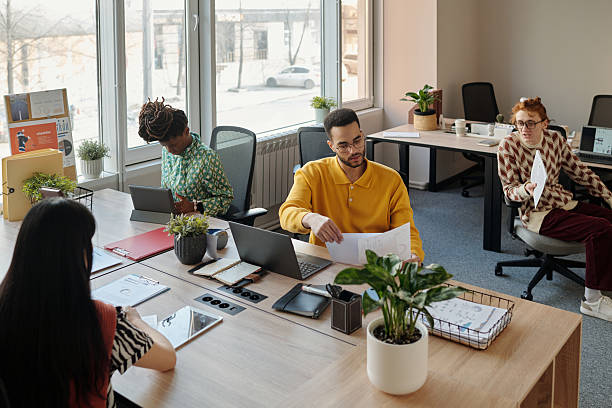 istock Analyzing Project Documents Young Adults of Diverse Ethnicity in Coworking Office 2222368870