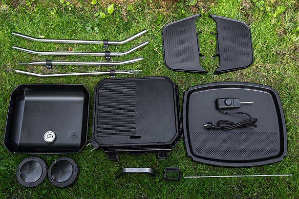 istock Assembling a new grill on the plot, installing an electric grill, hotplate, thermostat, power cable, 2222369348