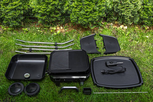 istock Assembling a new grill on the plot, installing an electric grill, hotplate, thermostat, power cable, 2222369350