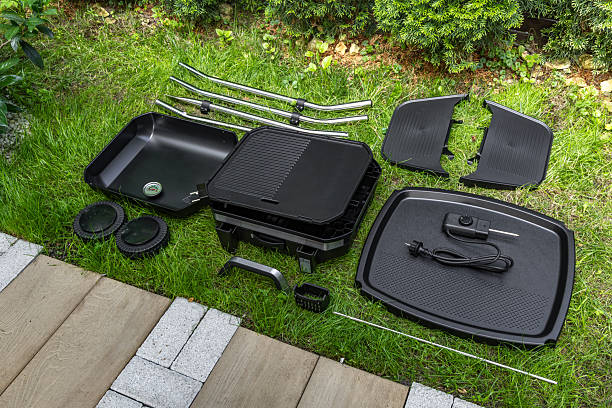istock Assembling a new grill on the plot, installing an electric grill, hotplate, thermostat, power cable, 2222369452