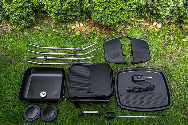 istock Assembling a new grill on the plot, installing an electric grill, hotplate, thermostat, power cable, 2222369463