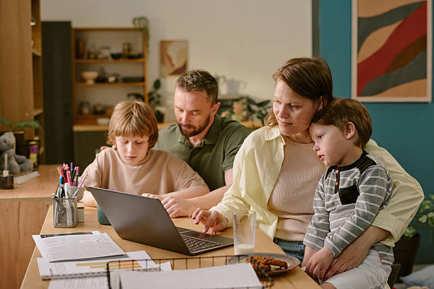 istock Family Collaborating on Remote Work and Learning at Home Together 2222369465