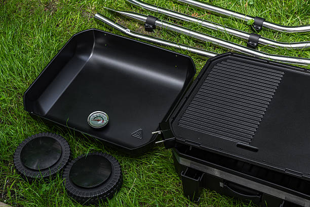 istock Assembling a new grill on the plot, installing an electric grill, hotplate, thermostat, power cable, 2222369658