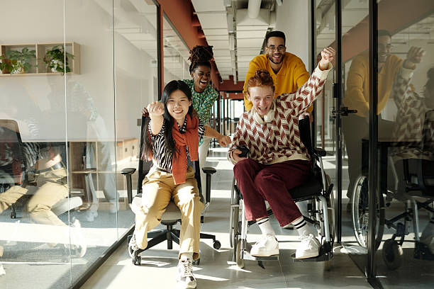 istock Celebrating Success with Diverse Young Adults Collaborating in Creative Coworking 2222377513