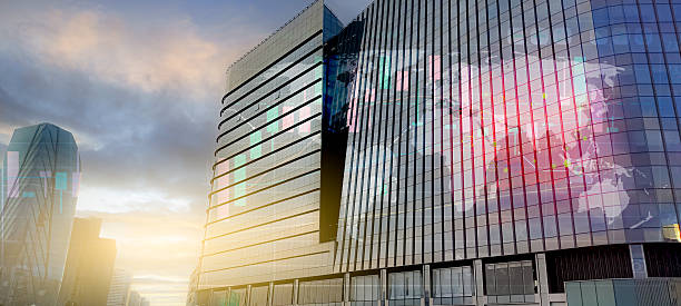istock Modern corporate headquarters office with glass facade reflecting digital world map. Global business network, technology leadership, and international corporate success. Worldwide economic growth. 2222381792