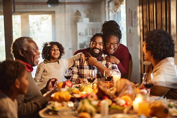 istock Happy black extended family enjoying in lunch at dining table. 2222384066