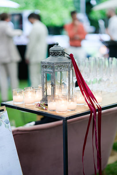 istock Elegant outdoor wedding reception table with candles and decorative lantern 2222385974
