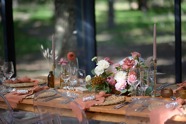 istock Elegant wedding reception table setup featuring floral centerpiece and candle decor 2222386007