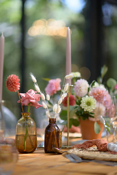 Elegant wedding table decor with flowers and candles in a natural setting