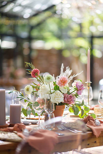 istock Elegant wedding table setting with floral centerpiece and rustic decor 2222386280