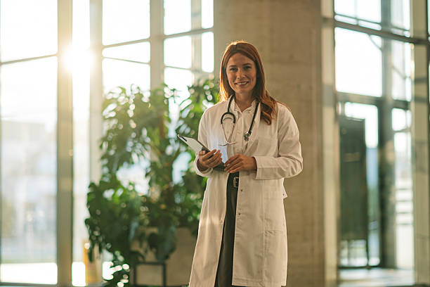 istock Confident doctor holding digital tablet in modern hospital 2222386474