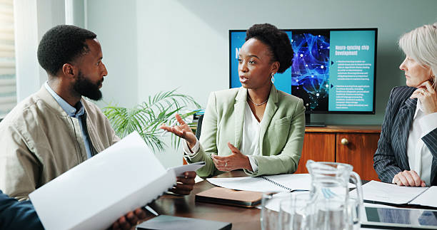istock People, manager and explain in presentation at office for planning, neuroscience and innovation ideas. Staff, meeting and briefing paperwork, brain technology and proposal report with neurofeedback 2222388169