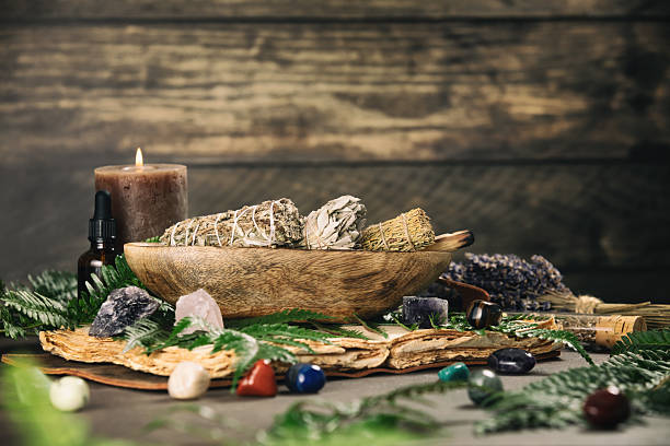 istock Aromatic Sage Bundles with Healing Crystals on Wooden Table 2222388252