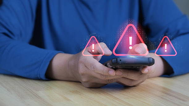 istock A person is using a smartphone with virtual error 404 alerts on the screen, representing cyber attacks, security warnings, and the dangers of network failures and spam in digital technology. 2222388486