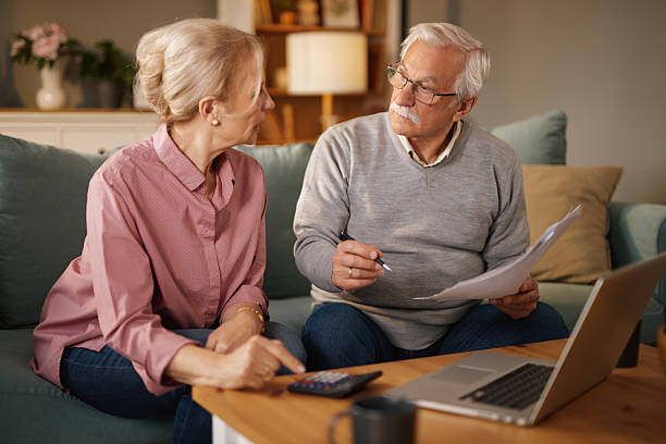 istock Senior couple doing home finances discussing life insurance 2222389945