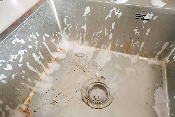 istock Cleaning Process of a Dirty Kitchen Sink 2222391292