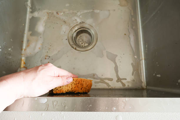 istock Cleaning Process of a Dirty Kitchen Sink 2222391302
