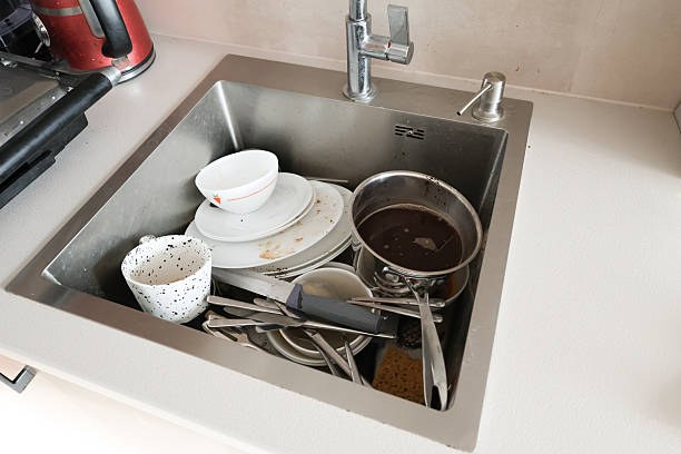 istock Cleaning Process of a Dirty Kitchen Sink 2222391308