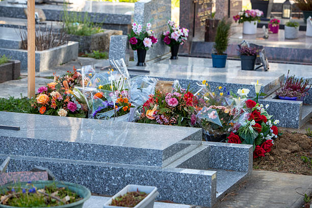 istock A fresh grave in an urban cemetery. 2222394163
