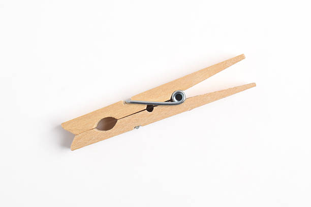 istock Wooden clothes pin on white background 2222395336