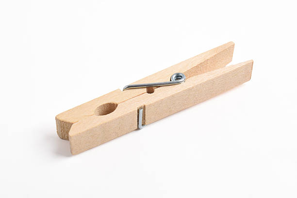istock Wooden clothes pin on white background 2222395347